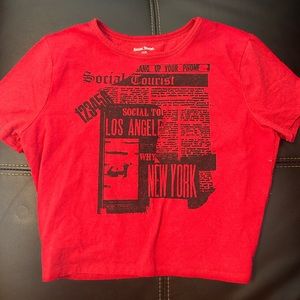Social Tourist red graphic baby tee